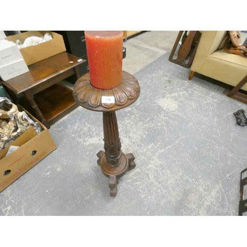 194 - 19th century carved floor standing candlestick.