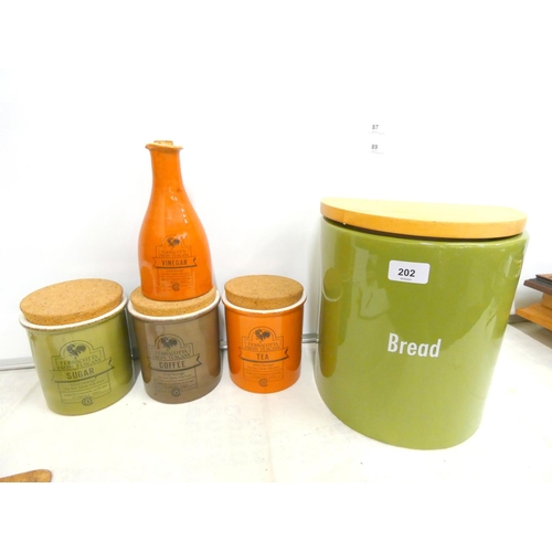 202 - Large ceramic bread bin and four Terracotta from Tuscany storage containers. (5)