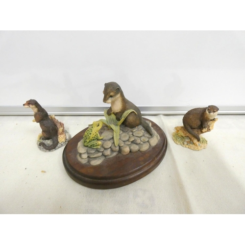 206 - Three Border Fine Arts otter figures. 