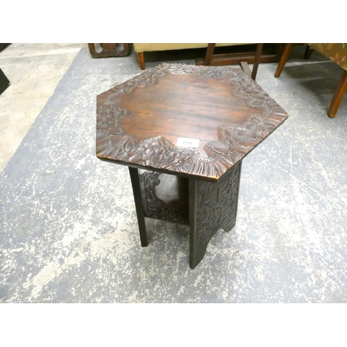 210 - Carved oak oriental style side table.