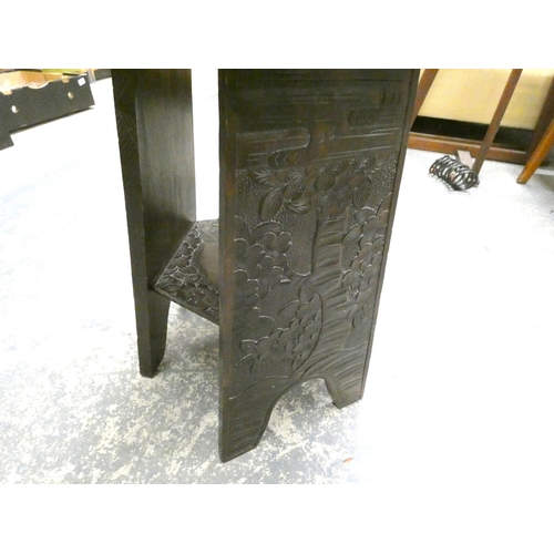 210 - Carved oak oriental style side table.