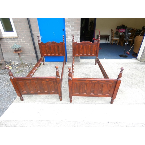 227 - Pair of pine single bed frames.