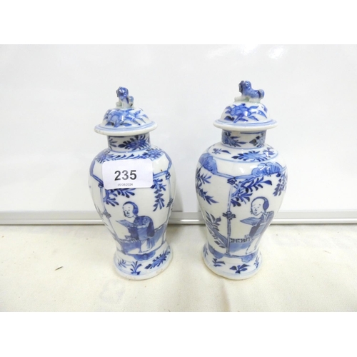 235 - Pair of Chinese blue and white lidded baluster vases with foo dogs to lid.