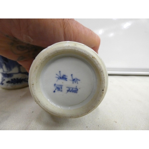 235 - Pair of Chinese blue and white lidded baluster vases with foo dogs to lid.