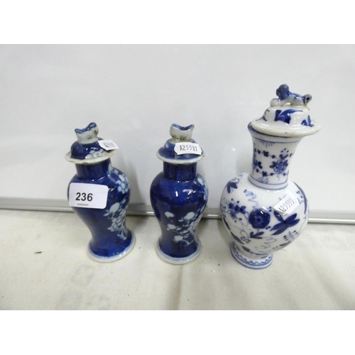 236 - Small pair of Chinese blue and white lidded baluster vases with prunes pattern and four character ma... 