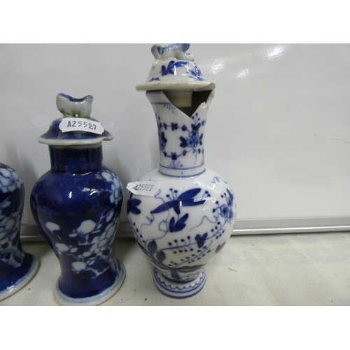 236 - Small pair of Chinese blue and white lidded baluster vases with prunes pattern and four character ma... 