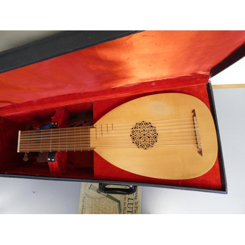 427 - Contemporary bowlback lute with pierced soundhole, gut strings and frets in fitted hard case.