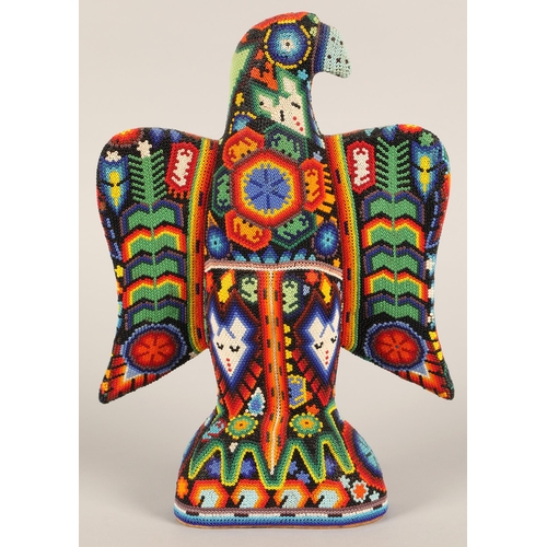 26 - A Mexican Huichol beaded eagle figure, 32cm h