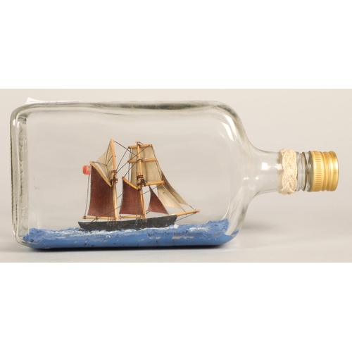 33 - Ship in a bottle, 'Topsail Schooner Sweetheart Abbey built 1875' written on base