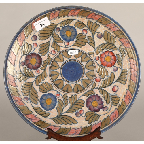 34 - Charlotte Rhead decorative charger, signed to base, 32cm diameter