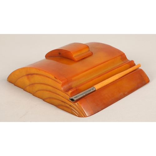 47 - Carvacraft, butterscotch amber coloured bakelite Art Deco ink stand with sliding inkwell lid