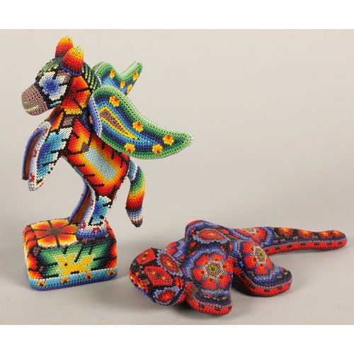 48 - Two Mexican beaded Huichol figures, lizard and winged horse