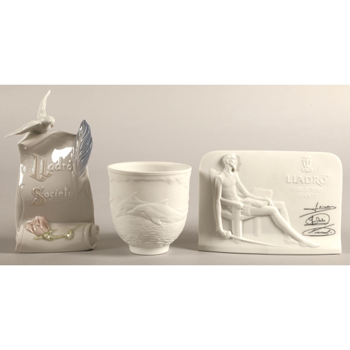 173 - Two Lladro Collectors Society ceramic plaques, and a collector's society dolphin vase (3)