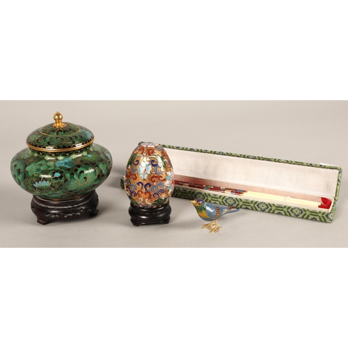 216 - Collection of cloisonne pieces including lidded pot on stand, egg, bird, and cased chopsticks