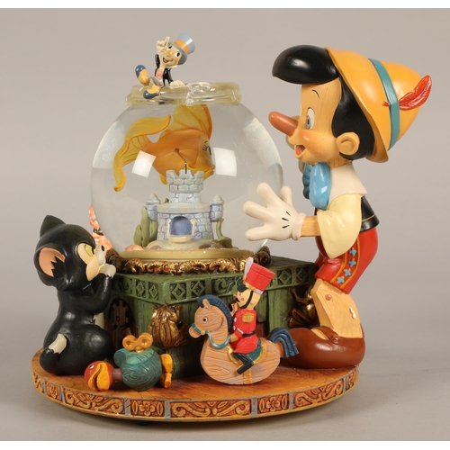 243 - Pinnochio Disney musical snowglobe