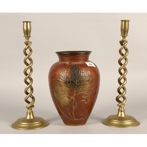 262 - Copper and brass Oriental vase with leaf design, 26cm high, with pair barley twist candlesticks