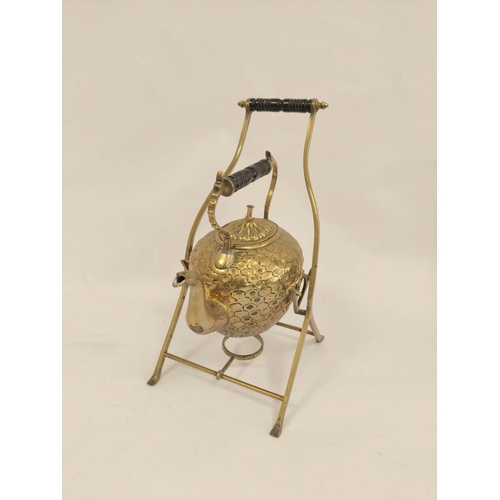 247 - Late Victorian hammered brass tea kettle of ovoid shape upon rustic stand with turned ebony handles ... 