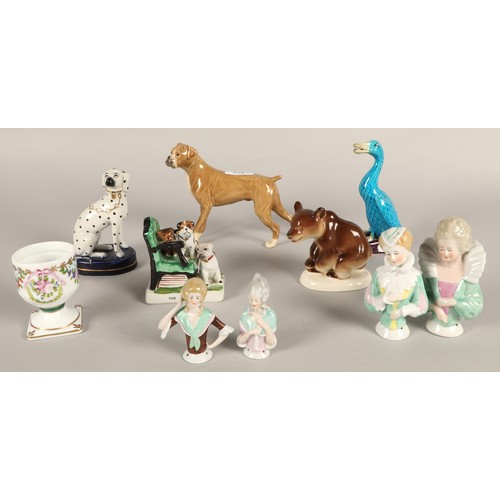 319 - Various continental style porcelain figurines to include fairing figure of dogs 'The Orphans',  bear... 