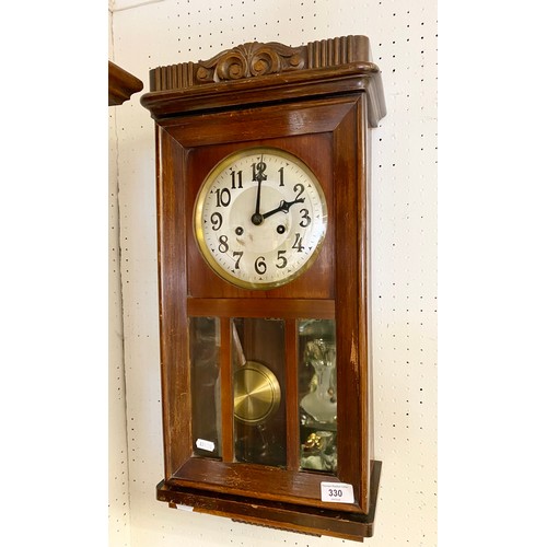 330 - Mahogany glazed wall clock with carved cornice, approx. 70cm high