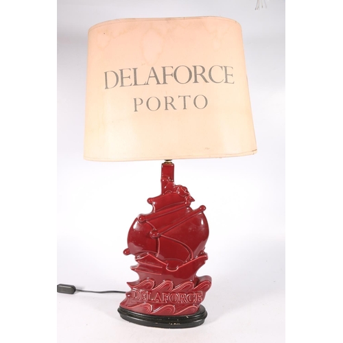 330 - 1920s advertising lamp and original shade for Delaforce Porto with stylised sailing ship, 73cm.