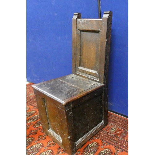 343 - 18th century style oak box settle, in the form of a hall chair, with hinged seat enclosing storage s... 