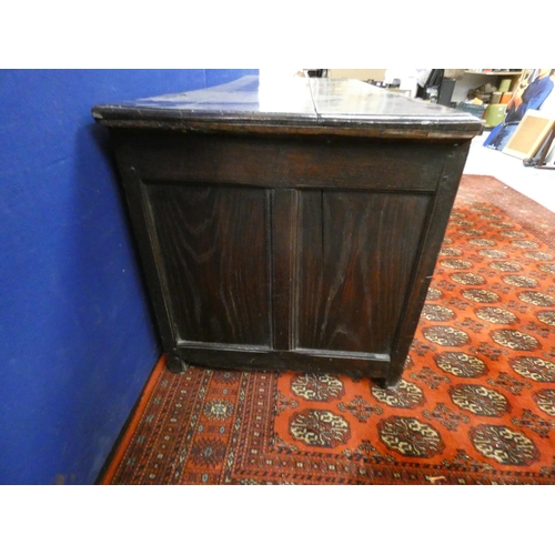 345 - 18th century carved oak coffer of large proportions with hinged top above three panels bearing allov... 