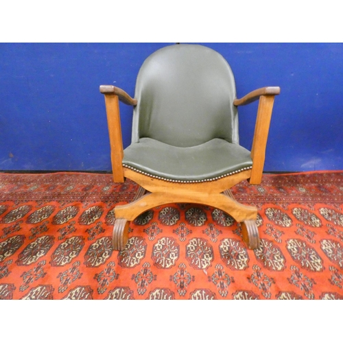 379 - Early 20th century Arts & Crafts oak and leather low seated cross frame tub chair.