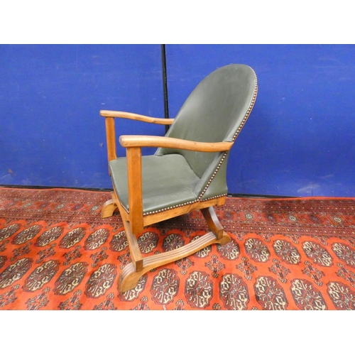 379 - Early 20th century Arts & Crafts oak and leather low seated cross frame tub chair.