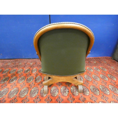 379 - Early 20th century Arts & Crafts oak and leather low seated cross frame tub chair.