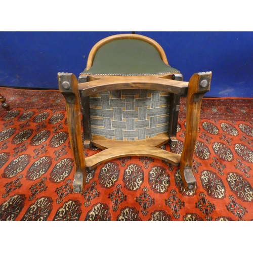 379 - Early 20th century Arts & Crafts oak and leather low seated cross frame tub chair.