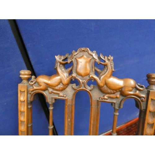 382 - Unusual 19th century oak folding chair with carved heraldic cresting.