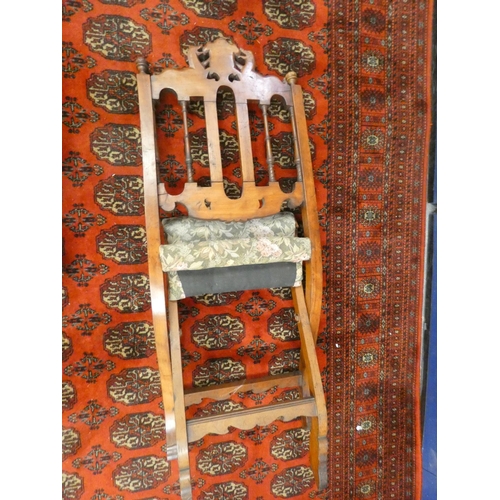 382 - Unusual 19th century oak folding chair with carved heraldic cresting.