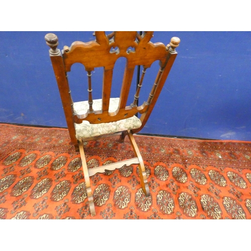 382 - Unusual 19th century oak folding chair with carved heraldic cresting.