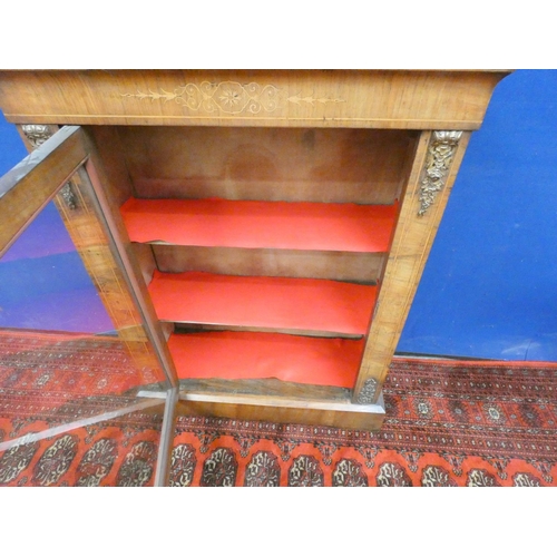 384 - Victorian inlaid walnut pier cabinet with glazed door enclosing shelves.