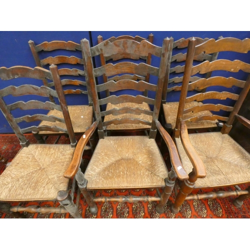 386 - Set of six elm ladderback chairs in Lancashire style with rush seats, including two with arms.