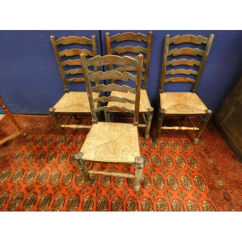 386 - Set of six elm ladderback chairs in Lancashire style with rush seats, including two with arms.