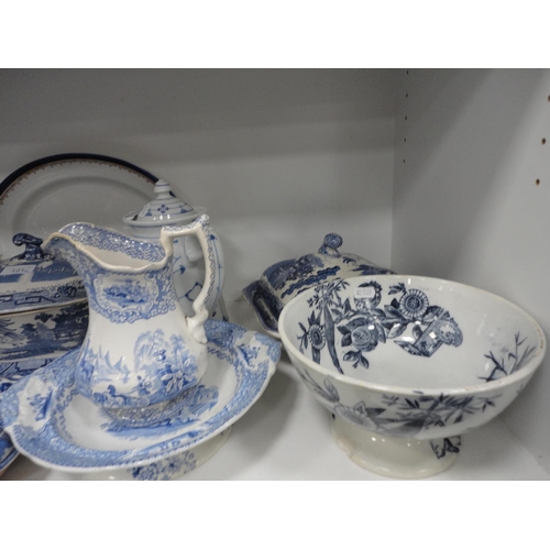 101 - Victorian and later blue and white wares to include tureens etc (one shelf).