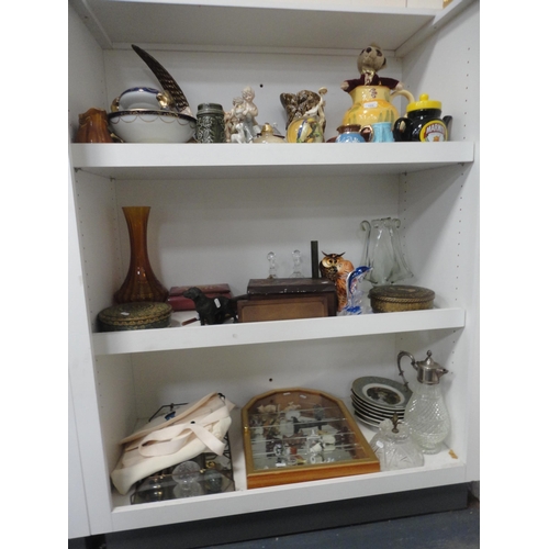 109 - Ornaments, vases, wooden items, ornaments contained in a display case, claret jug, egg ornaments, pl... 