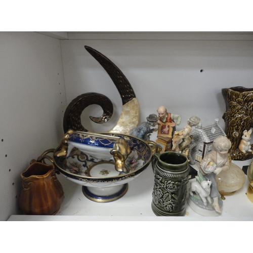109 - Ornaments, vases, wooden items, ornaments contained in a display case, claret jug, egg ornaments, pl... 