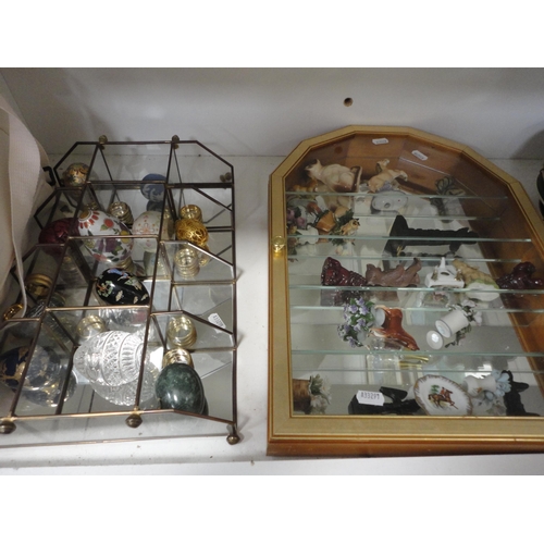 109 - Ornaments, vases, wooden items, ornaments contained in a display case, claret jug, egg ornaments, pl... 