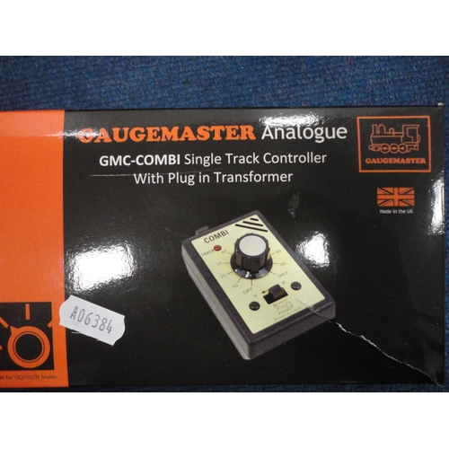 12 - Carton containing model railway accessories to include Gaugemaster analogue single track controller,... 
