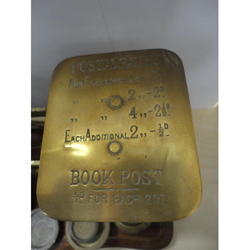 182 - Two sets of brass and oak postal scales with weights.