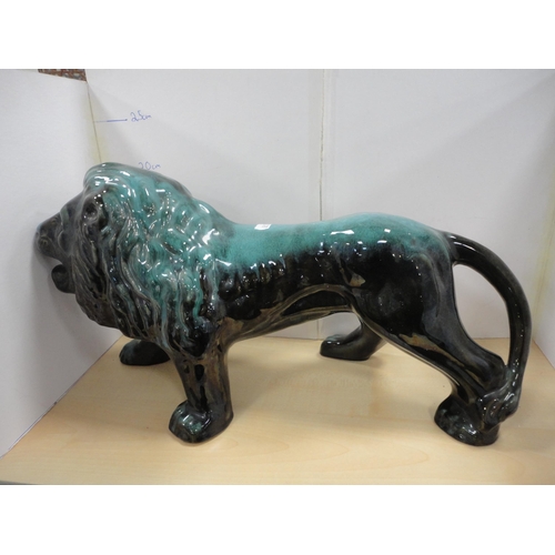184 - Blue Mountain-style large figure of a lion and a dolphin, also a vase and a jardini&egrave;re stand.... 