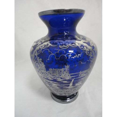 191 - Silver overlaid blue glass vase.