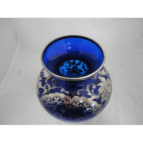 191 - Silver overlaid blue glass vase.