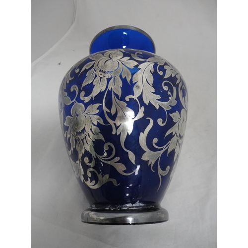 191 - Silver overlaid blue glass vase.