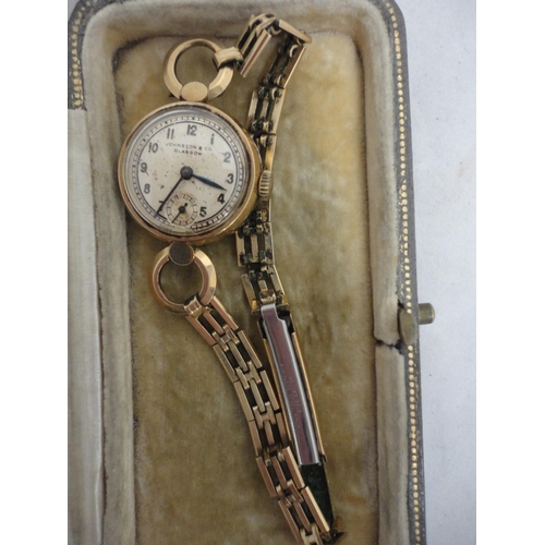 211 - 9ct gold vintage lady's wristwatch, named to the dial Johnson & Co., Glasgow., 15g gross.