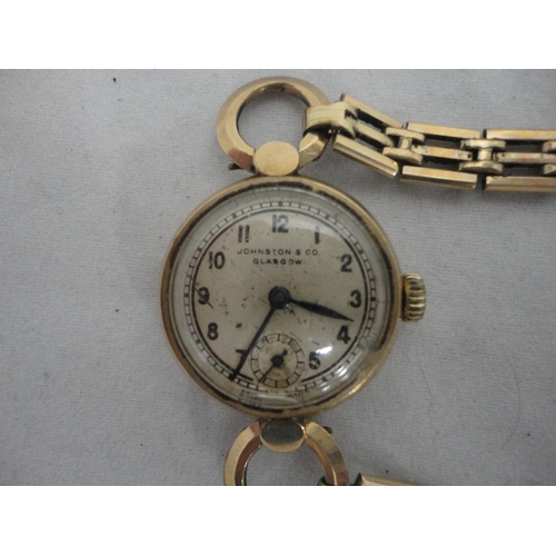 211 - 9ct gold vintage lady's wristwatch, named to the dial Johnson & Co., Glasgow., 15g gross.