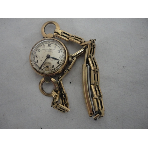 211 - 9ct gold vintage lady's wristwatch, named to the dial Johnson & Co., Glasgow., 15g gross.