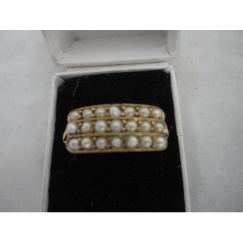 212 - 9ct gold pearl-set channel ring, 3.2g gross.